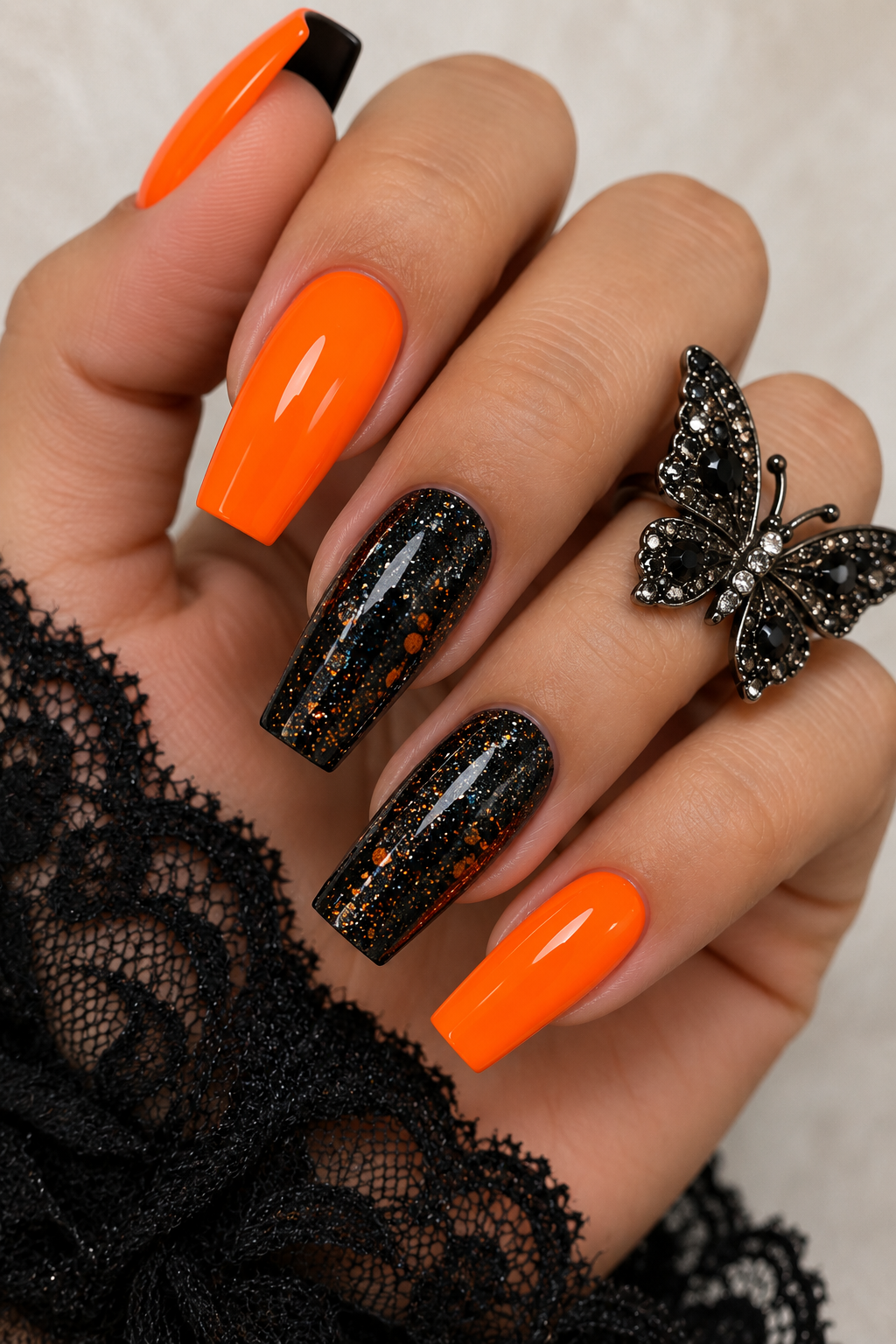 Matte Black with Glitter Orange Accents for a Glam Touch