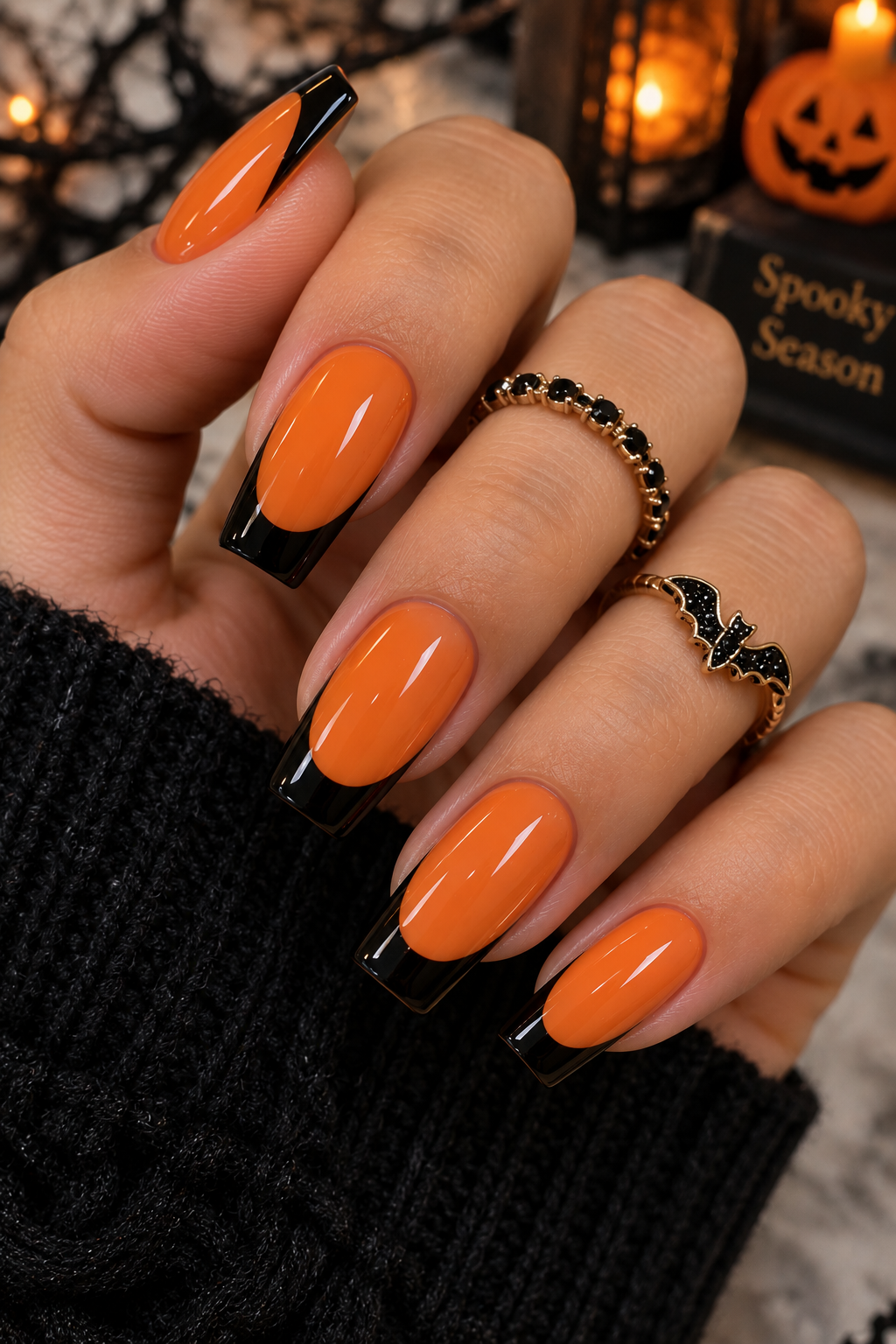 Black French Tip with Orange Base for a Classic Twist